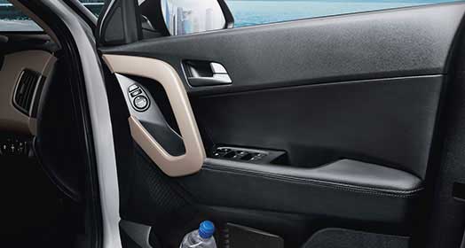 Front passenger side door storage with armrest