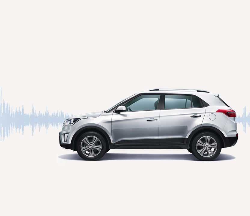 Side view of silver Creta with sound wave graphic on the background