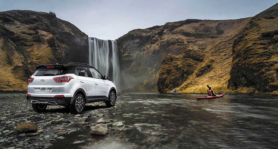 Right side rear view of driving silver creta on the road